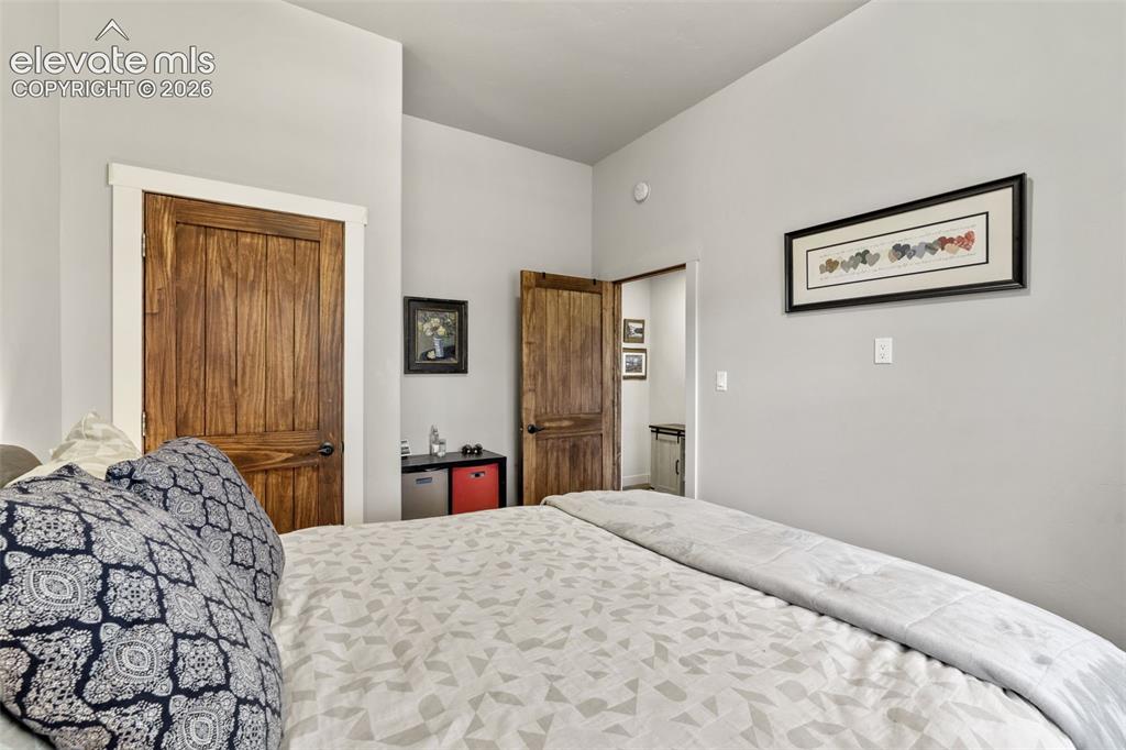 Image 28 of 42: Solid wood doors with white trim