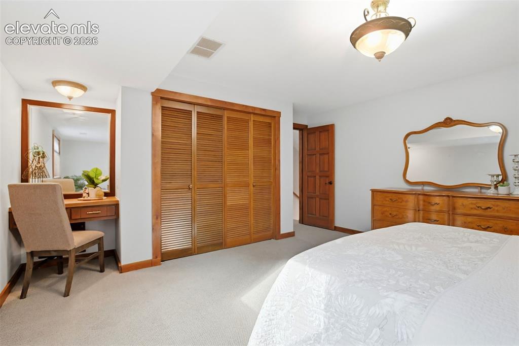 Image 28 of 50: This bedroom shares the hall bath.
