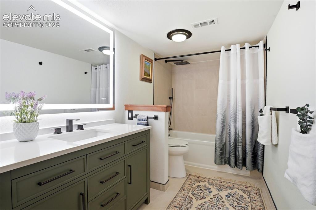 Image 29 of 50: This is a shared bathroom for the two mid level bedrooms.