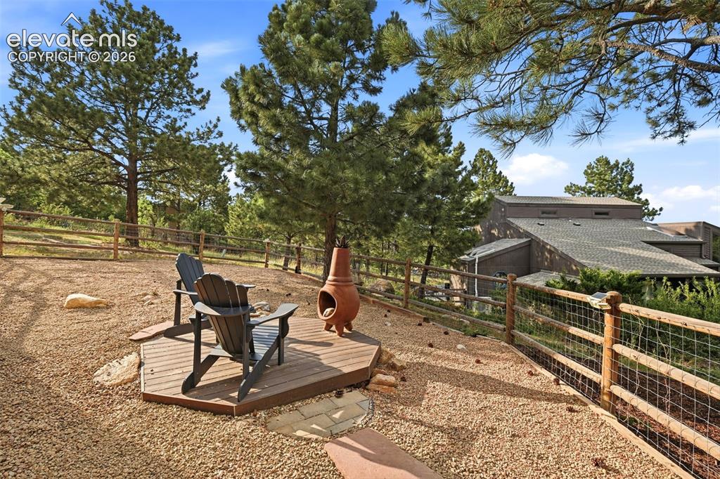 Image 44 of 50: The side yard is fenced for dogs and if you are concerned about kids needin