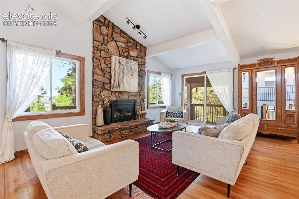 Image 5 of 50: There is a sliding glass door out to a covered patio that stays shaded in t