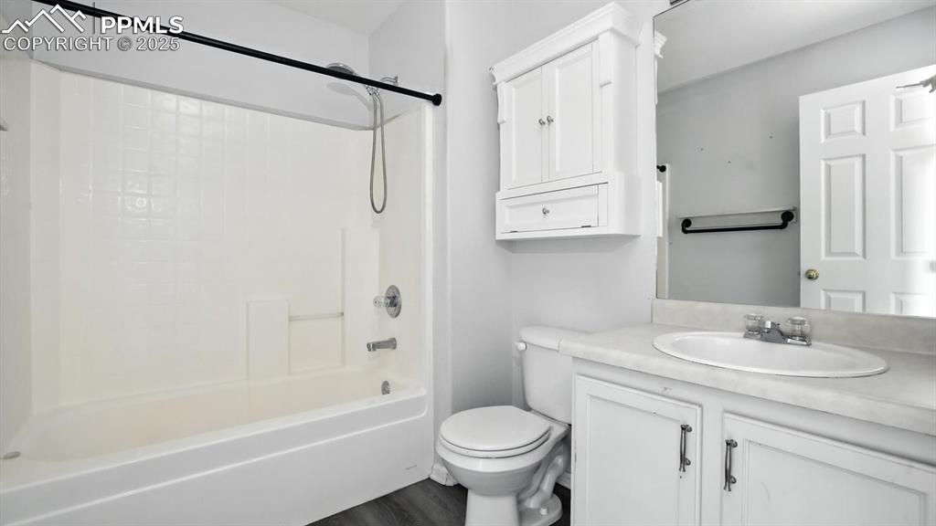Image 11 of 26: Full Hall Bathroom with vanity, mirror, and tub/shower.