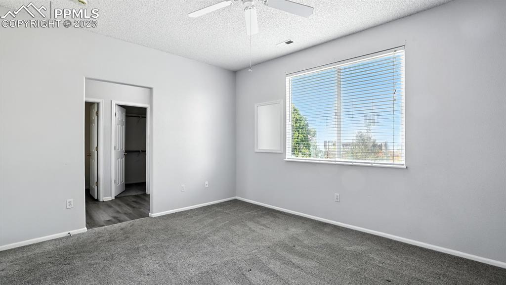Image 16 of 26: View into the hallway from the Primary Suite.