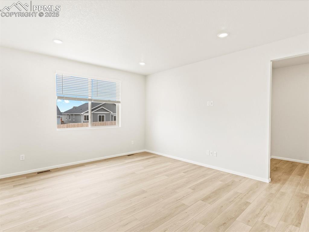 Image 11 of 32: Unfurnished room with light wood-style flooring and recessed lighting