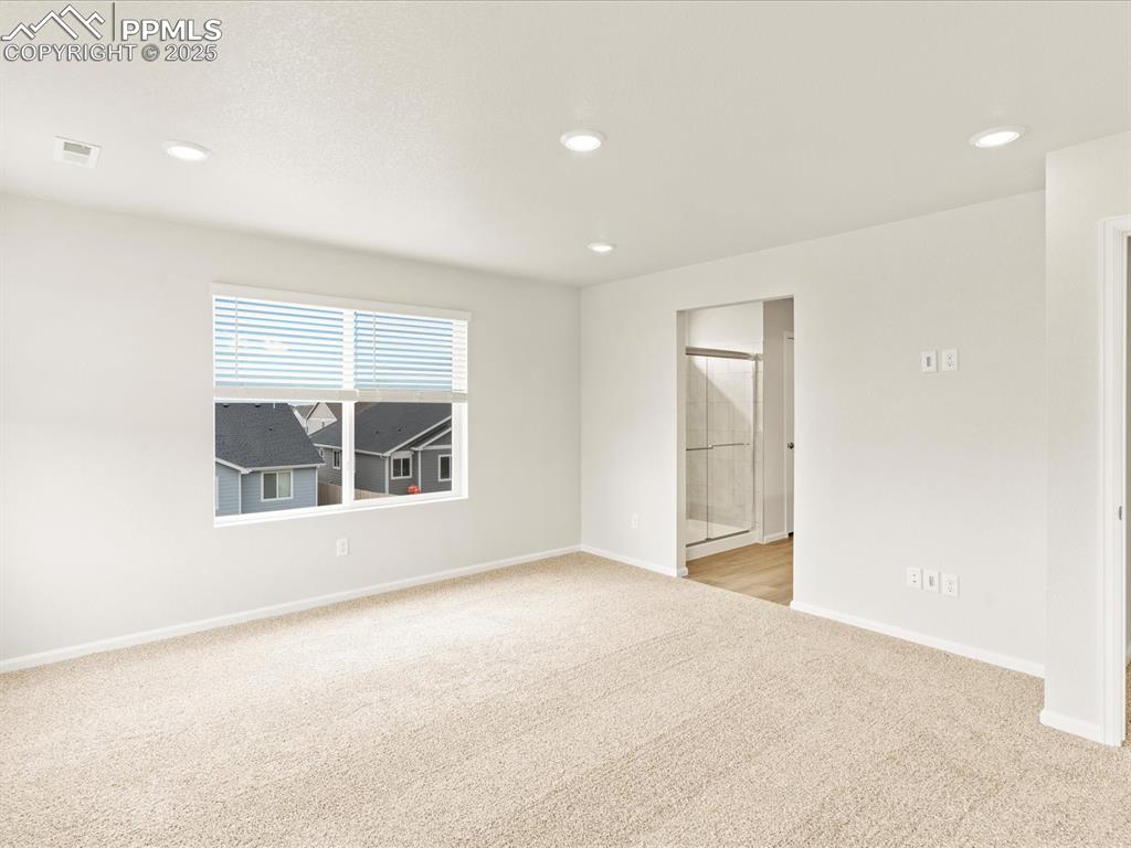 Image 15 of 32: Spare room featuring light colored carpet and recessed lighting