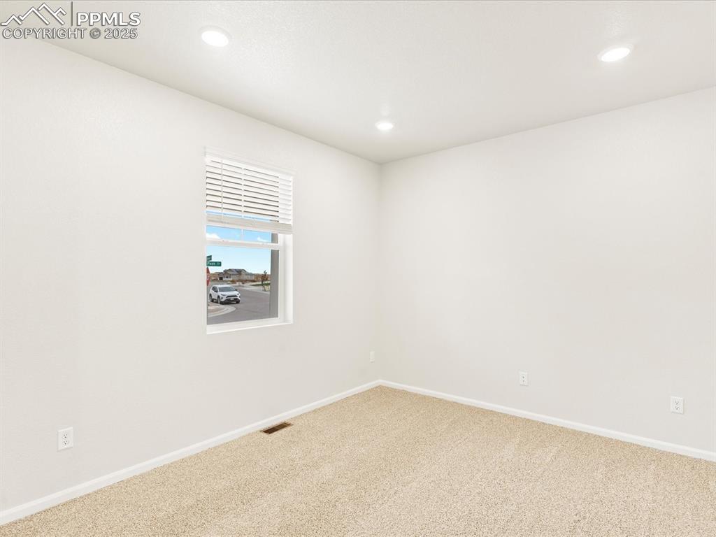 Image 2 of 32: Spare room with carpet and recessed lighting