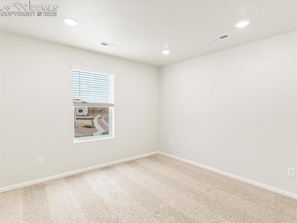 Image 20 of 32: Carpeted empty room featuring baseboards and recessed lighting