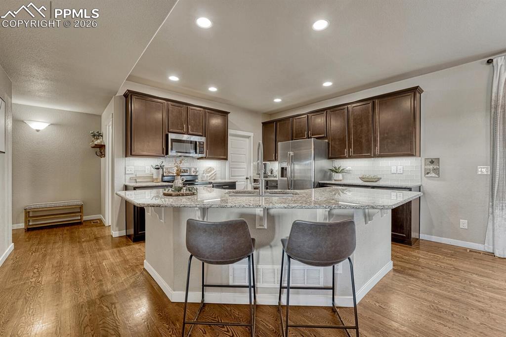 Image 13 of 50: Breakfast bar for informal dining and conversations with the chef.