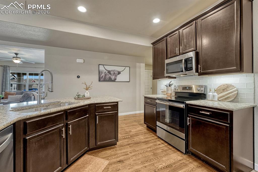 Image 17 of 50: The Kitchen includes a dual stainless steel sink.