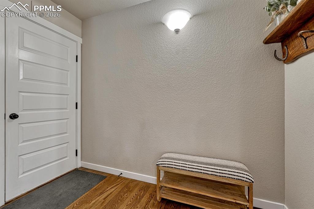 Image 19 of 50: Mudroom/dropzone area with access to the 4-car garage.