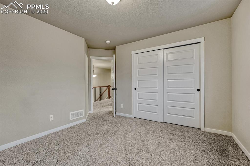 Image 25 of 50: Upper Level Bedroom #1.