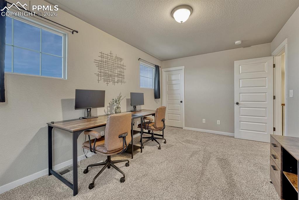 Image 27 of 50: Bedroom #2 has a walk in closet (currently being used as an office).