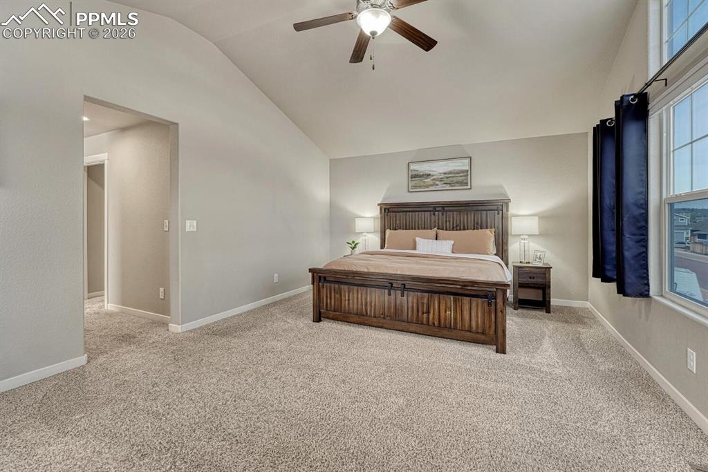 Image 29 of 50: The Primary Suite has a sitting area, a lighted ceiling fan, a walk in clos