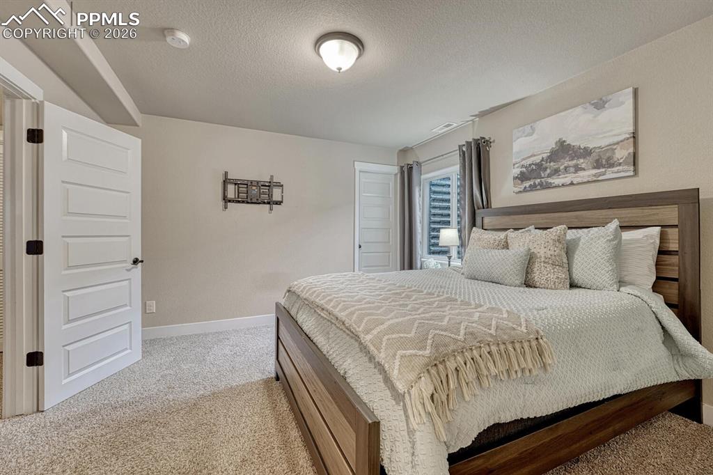 Image 42 of 50: Basement Bedroom.