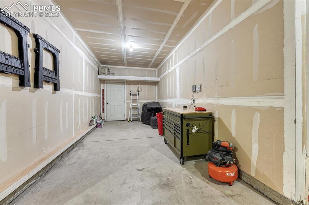 Image 46 of 50: 4th car garage can be used for storage, bikes, golf cart.