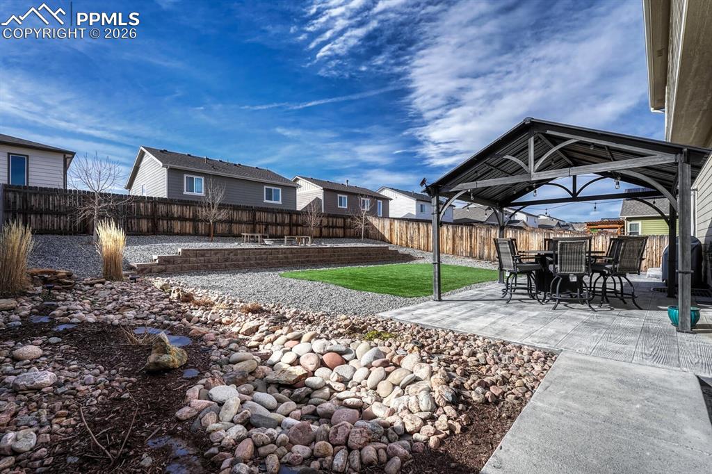 Image 49 of 50: View of fenced backyard.