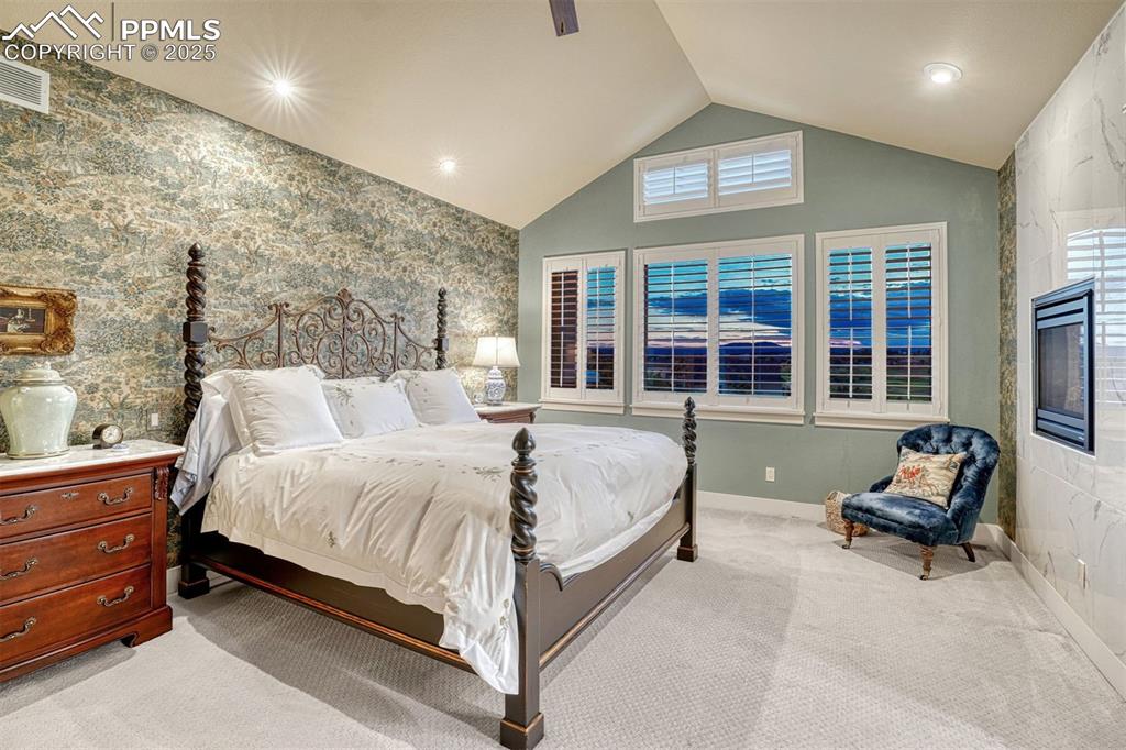 Image 20 of 45: Primary suite also features wood shutters, has plush carpet and is the perf