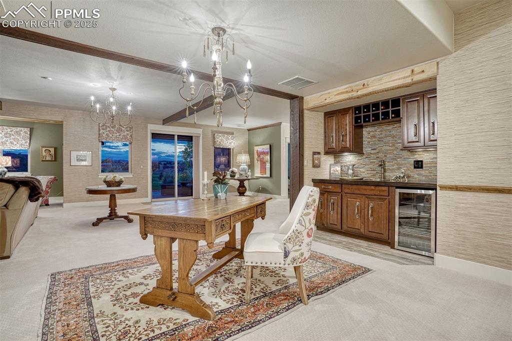 Image 32 of 45: Walkout from the recreation room to the covered outdoor living room