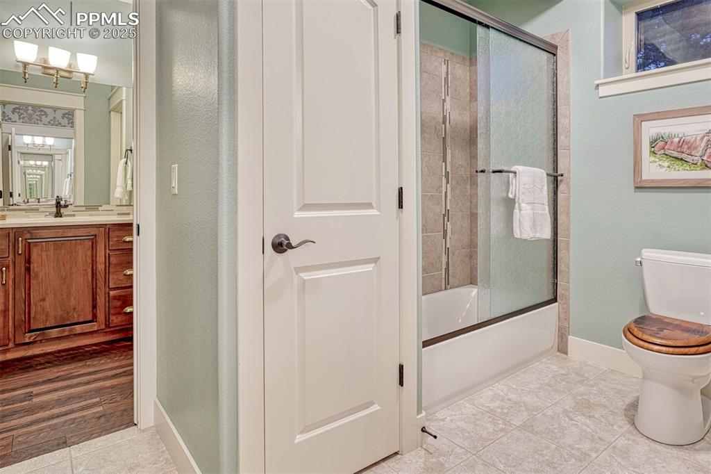 Image 36 of 45: Thoughtfully designed, the downstairs bath has the shower and commode separ