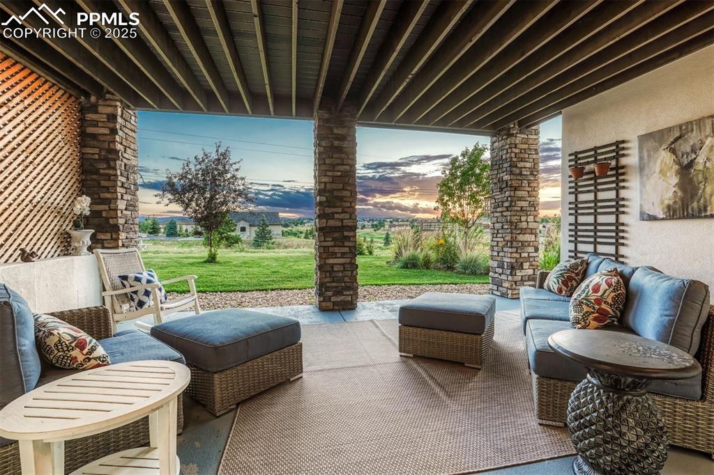 Image 41 of 45: Steps from the recreation room, you can take advantage of the covered patio