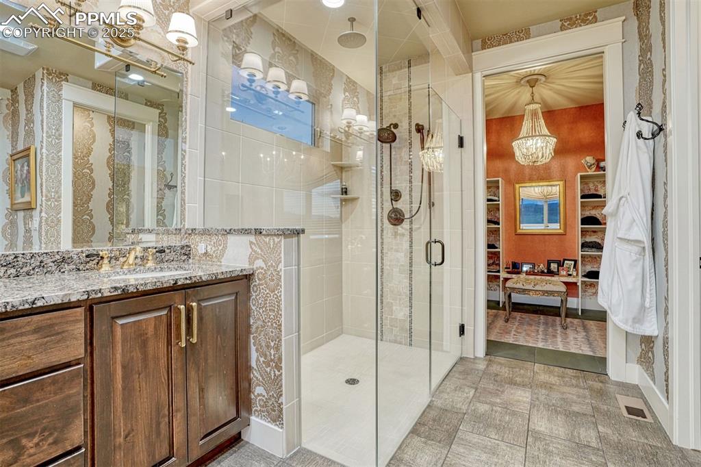 Image 6 of 45: Step into a spa-like retreat in the primary bath, complete with boutique st