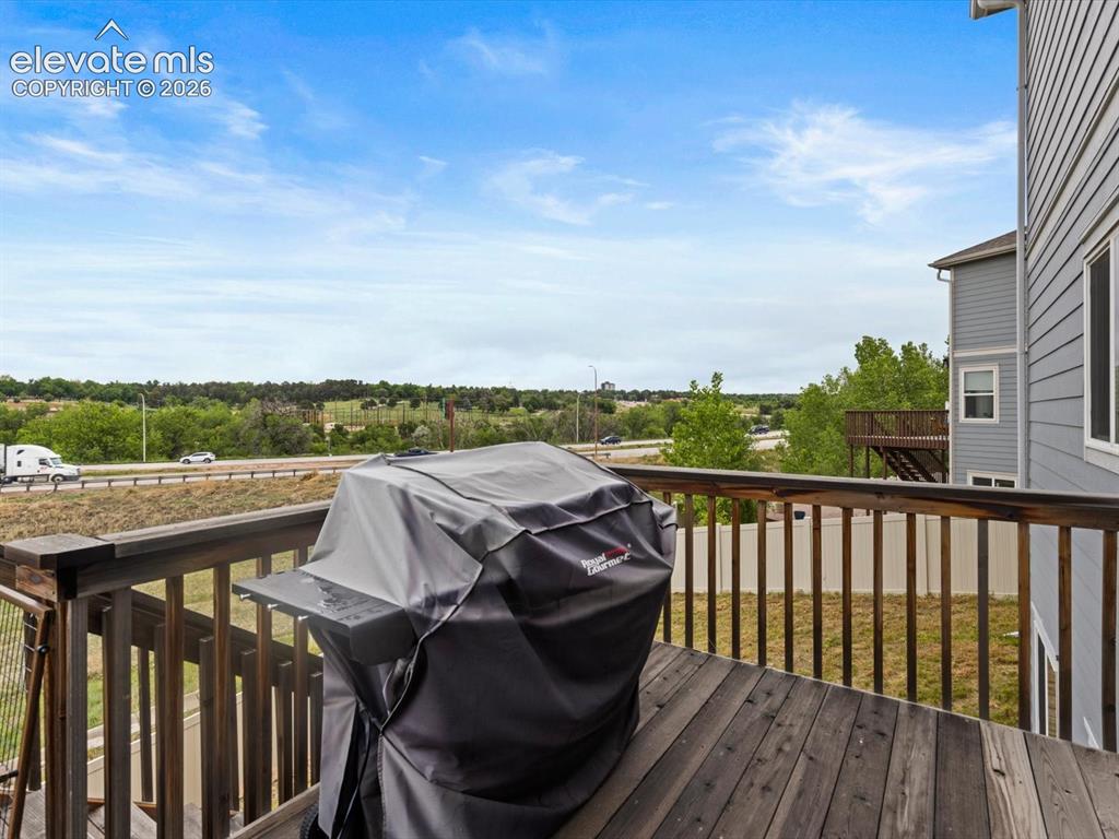 Image 15 of 45: Outdoor deck featuring wood-finish flooring, wood railings, and a partial v
