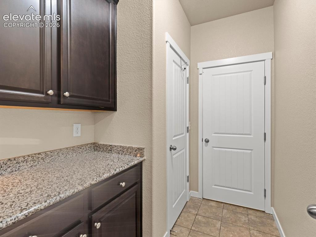 Image 22 of 45: Mudroom off kitchen leads to garage