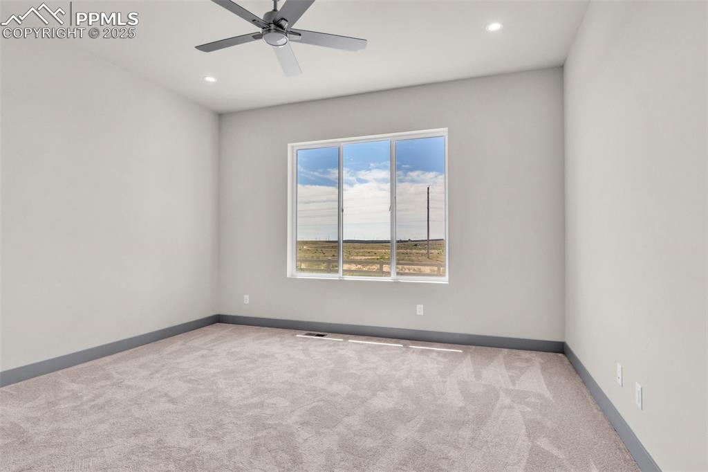 Image 20 of 50: Unfurnished room featuring recessed lighting, ceiling fan, baseboards, and