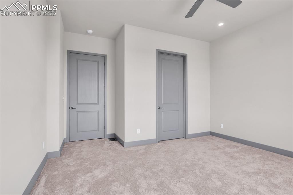 Image 21 of 50: Unfurnished bedroom with recessed lighting, baseboards, carpet, and ceiling