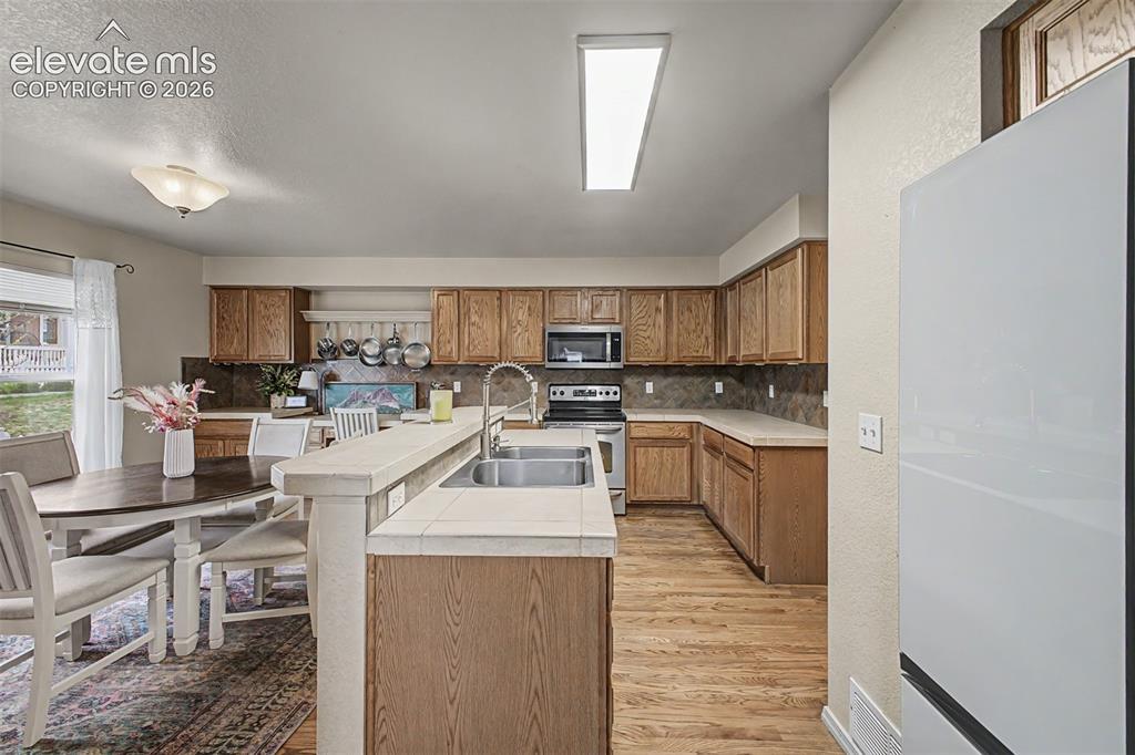 Image 10 of 35: A large kitchen with added counters and cabinets