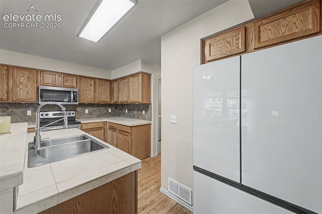 Image 11 of 35: Refrigerator front panels have different fronts