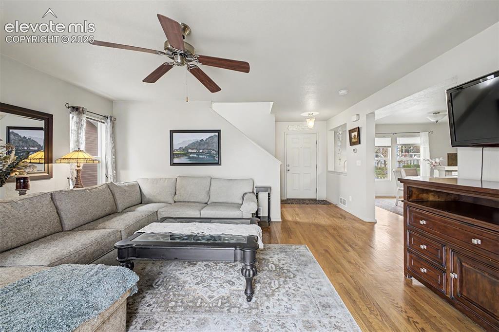 Image 5 of 35: Stunning family room with real oak flooring