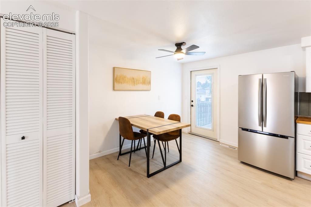 Image 10 of 32: Light wood-finish flooring with white walls and trim, featuring a white lou