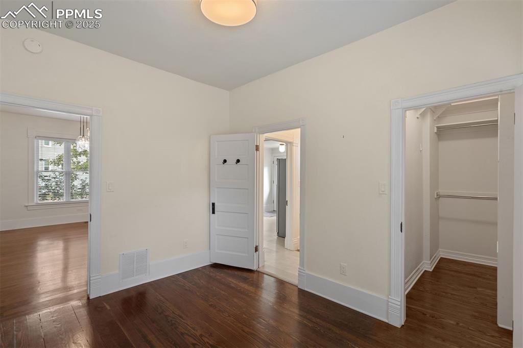 Image 14 of 32: 2nd bedroom with access to the bathroom, a walk in closet and adjoining sun