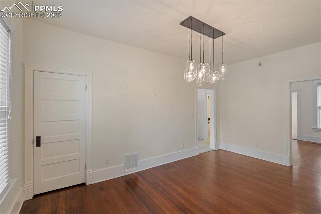 Image 7 of 32: Formal dining room with storage closet.