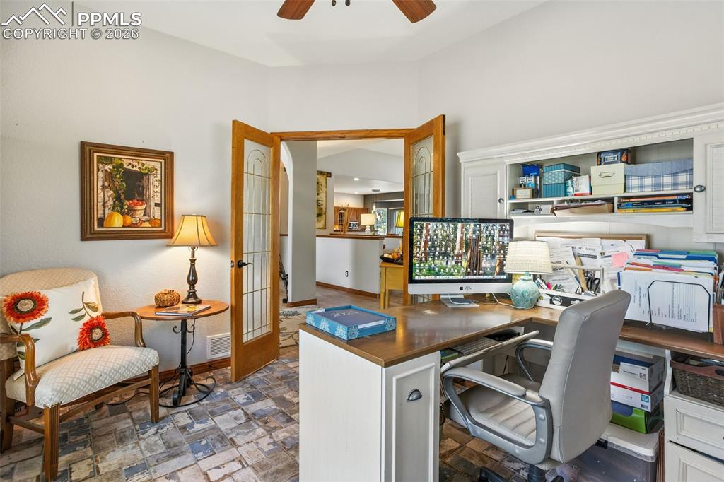 Image 11 of 50: French doors usher you into the main floor office