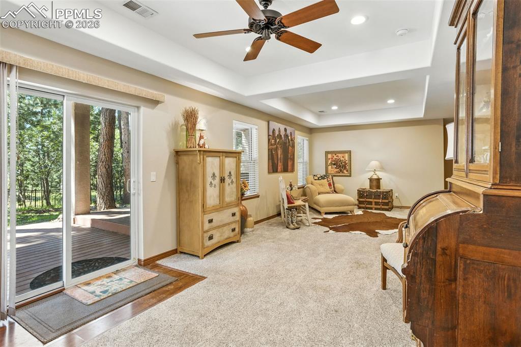 Image 25 of 50: Walkout to covered composite deck on lower level.  