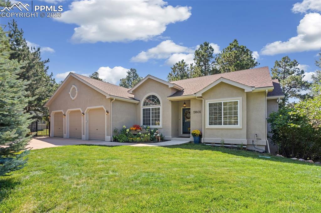 Image 45 of 50: auto sprinkler system keeps front yard lush
