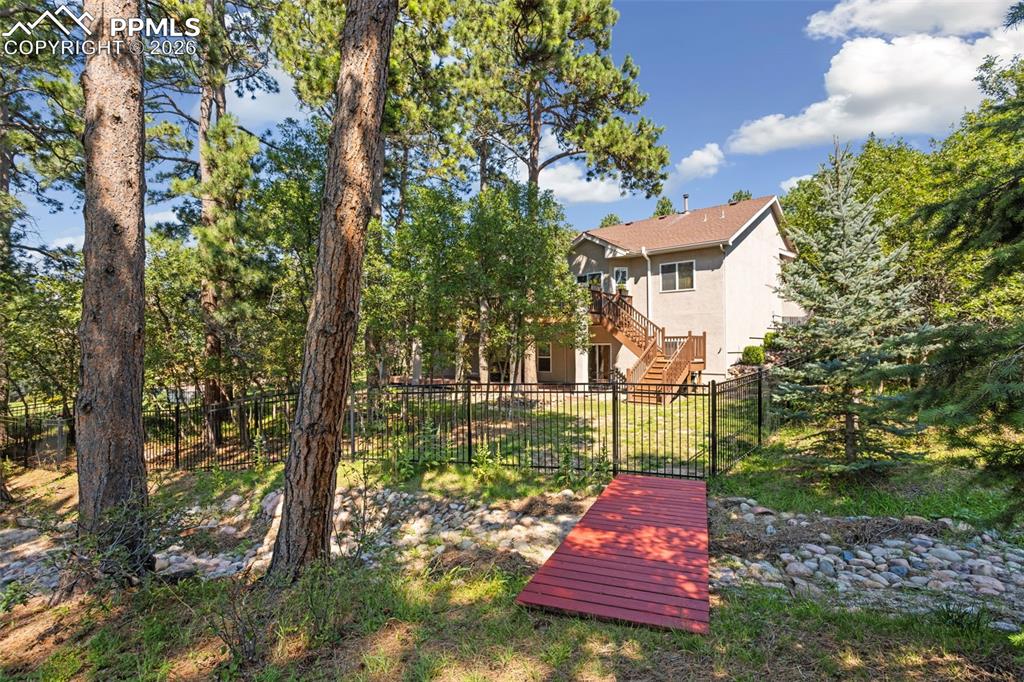 Image 48 of 50: Dry creek bed runs through the rest of the backyard.  No trolls living unde
