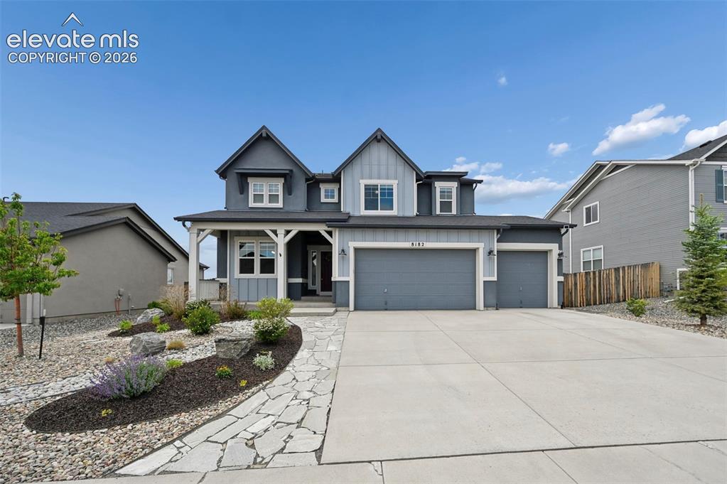 Image 1 of 47: Two-story exterior with a covered porch, attached two-car garage, and a con