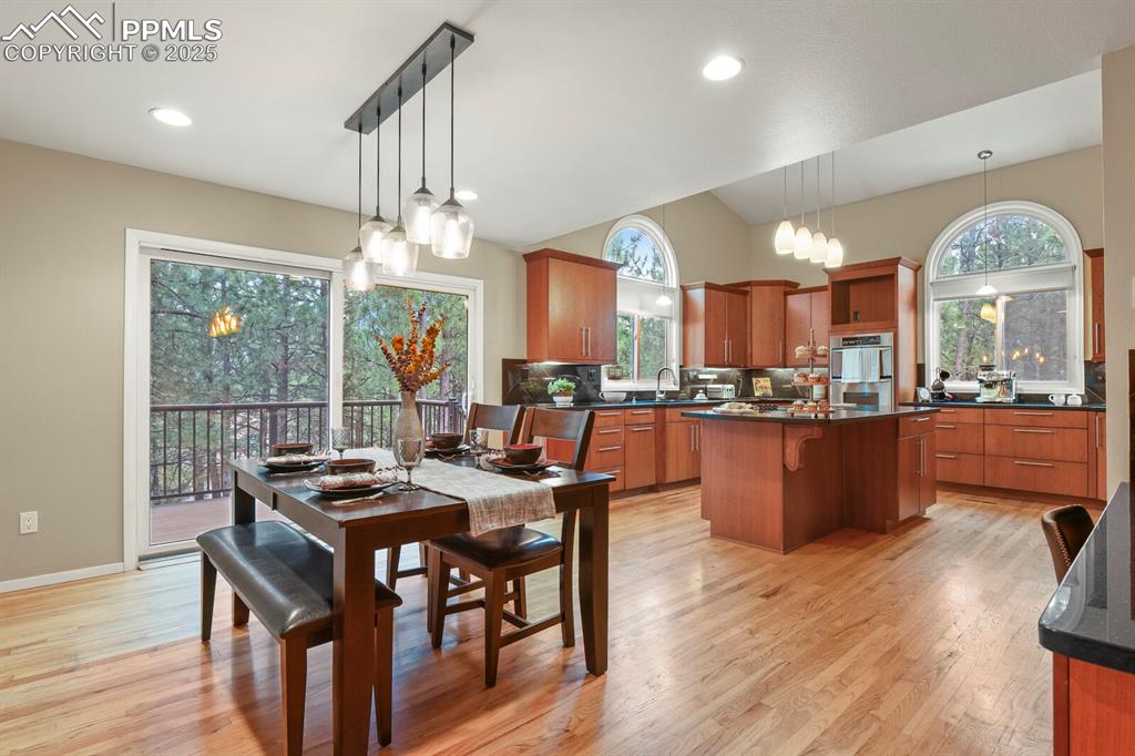 Image 11 of 50: Dining room featuring light wood-style flooring, plenty of natural light, r