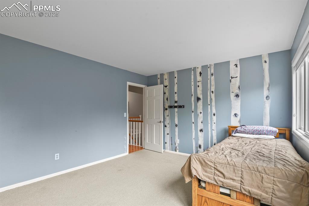 Image 27 of 50: Bedroom featuring carpet flooring and baseboards