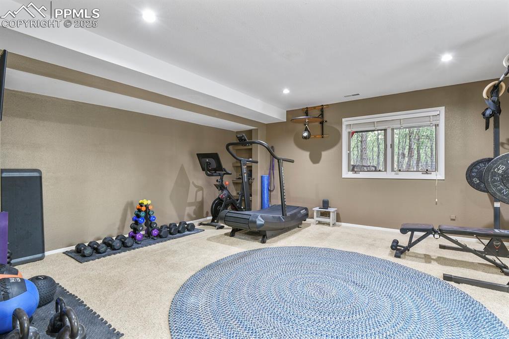 Image 36 of 50: Workout room featuring carpet floors and recessed lighting