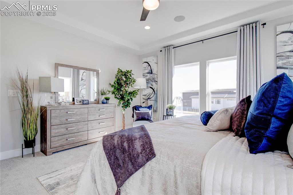 Image 11 of 19: Bedroom with light carpet and ceiling fan