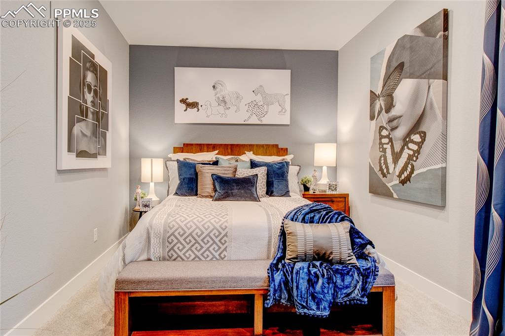 Image 18 of 19: Carpeted bedroom featuring baseboards
