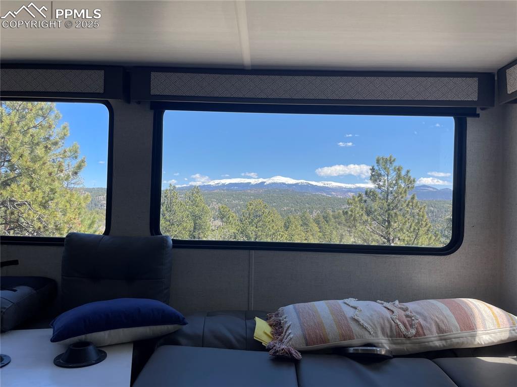 Image 17 of 22: Detailed view of a mountain backdrop