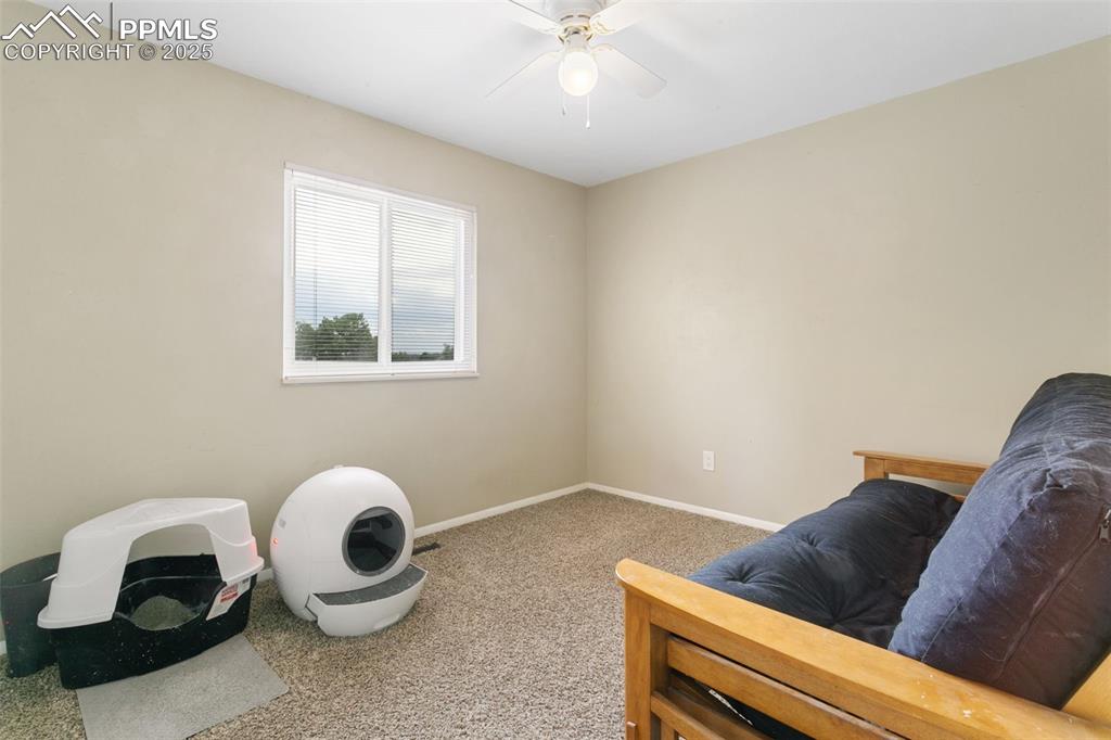Image 23 of 26: Sitting room featuring carpet flooring and a ceiling fan