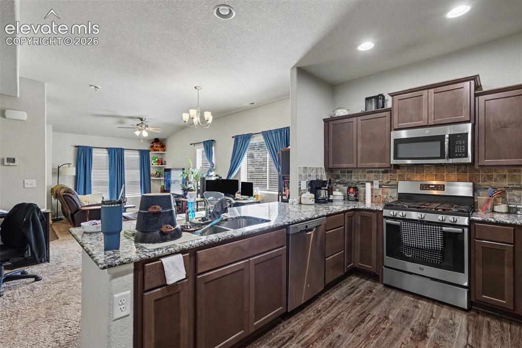 Image 13 of 26: The main level has a designated half bathroom!