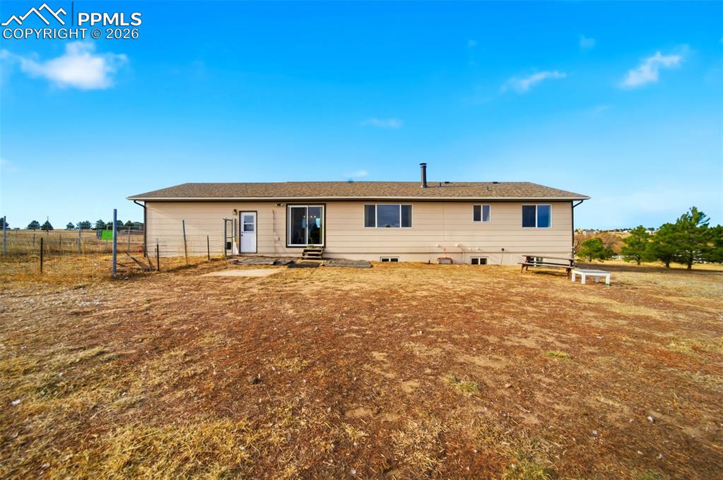 Image 29 of 37: Back of property with a patio