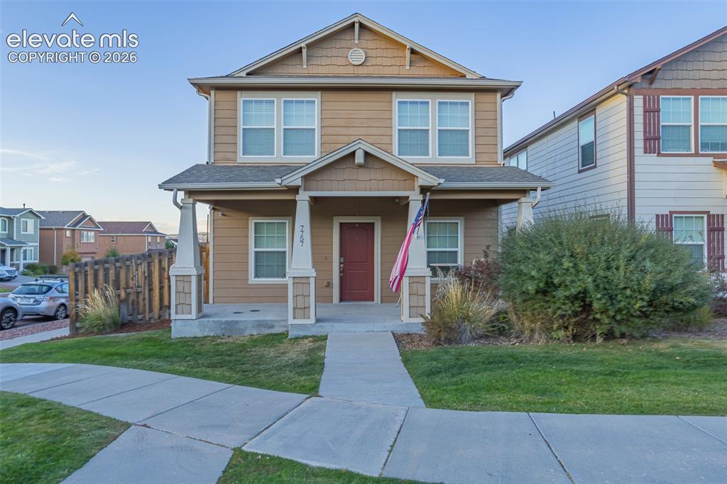 Image 1 of 30: Two-story exterior with horizontal siding, covered front porch, concrete wa